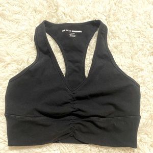 black low cut super flattering ruched sports bra.